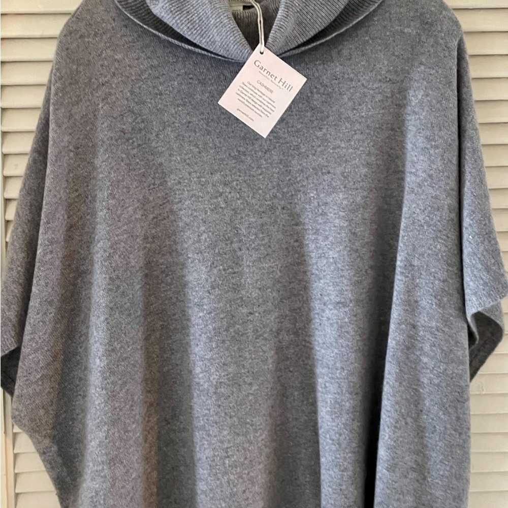 Grey cashmere poncho sweater.